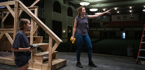 women building a theater set